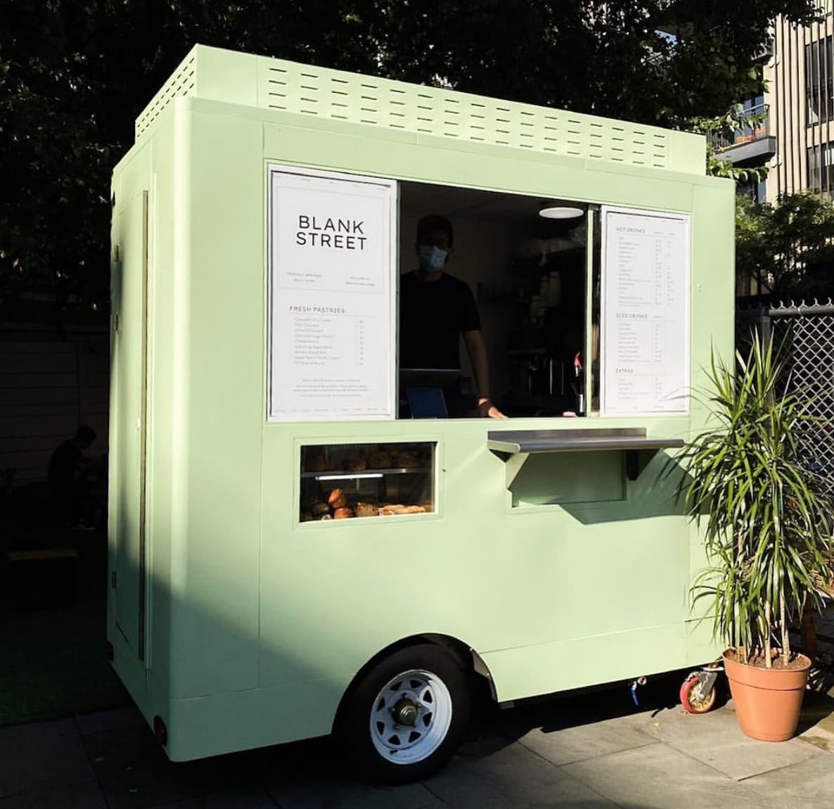 Blank Street branded coffee cart on a city street